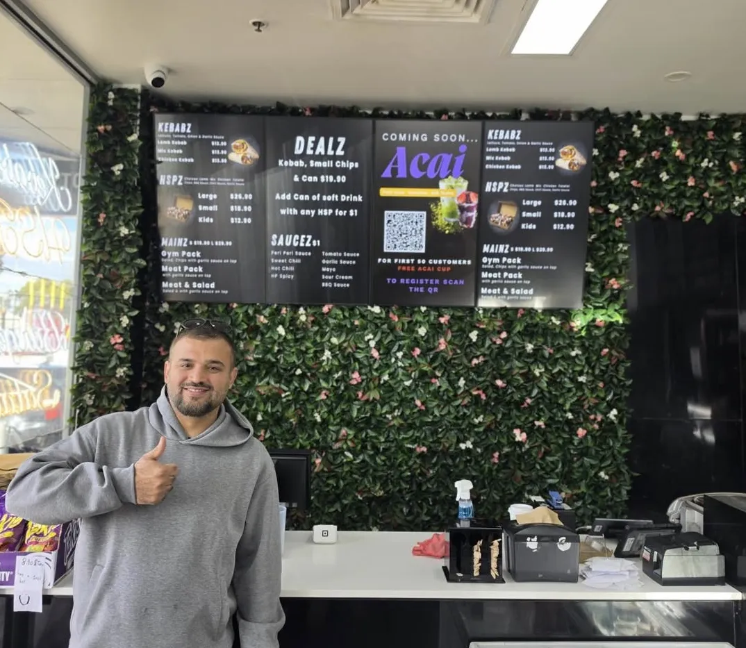 Digital menu boards at a kebab shop